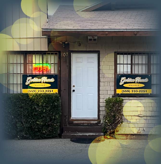 Street view of the Golden Hands Massage entrance at 807 E Hedges Ave in Fresno, displaying the open sign and contact phone number.